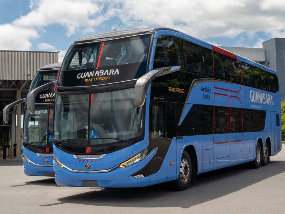 Two blue travel buses from Guanabara and Real Expresso parked. A road transport option to get to Chapada Diamantina.