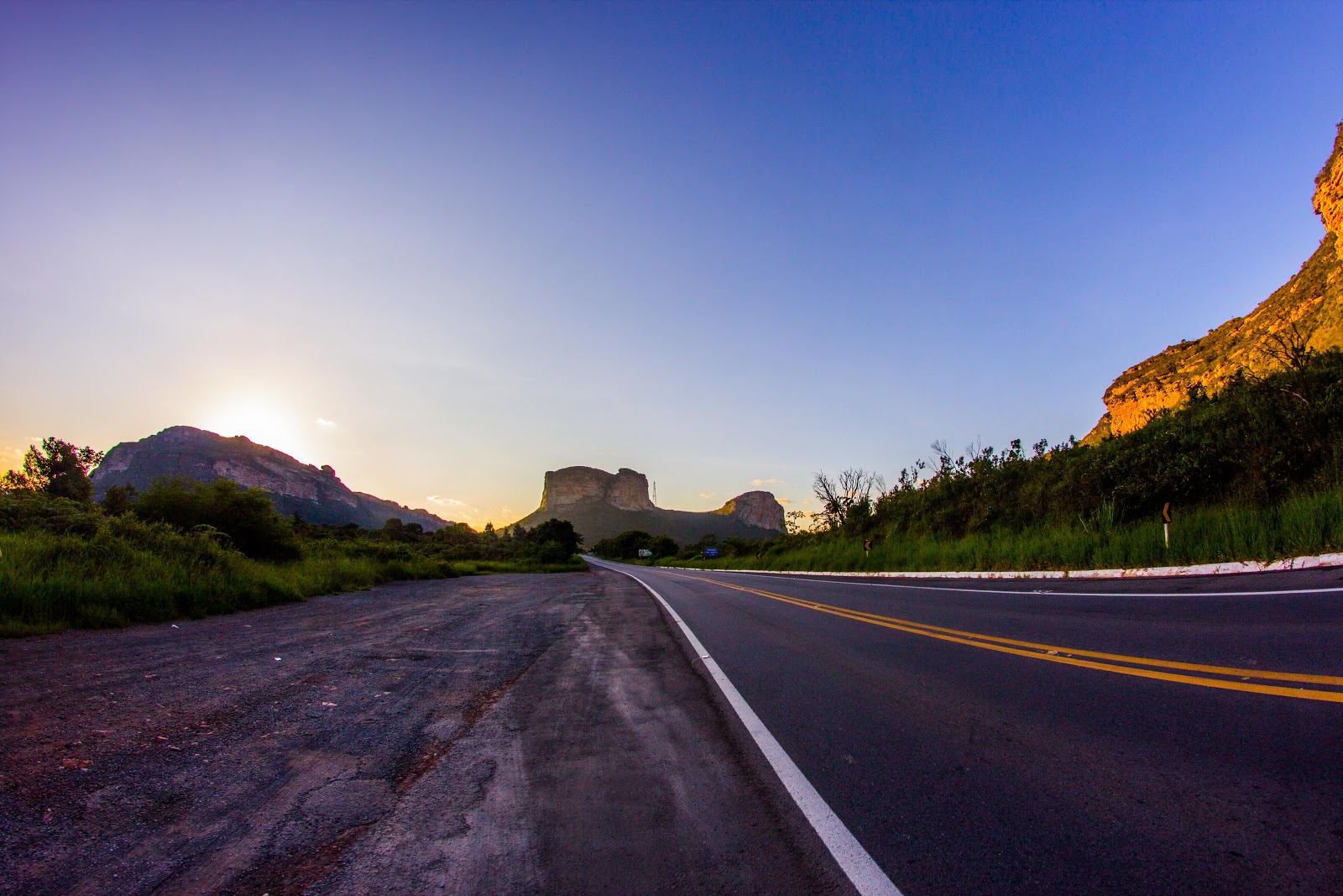  Empty paved highway leading towards the mountains of Chapada Diamantina Bahia at sunrise.